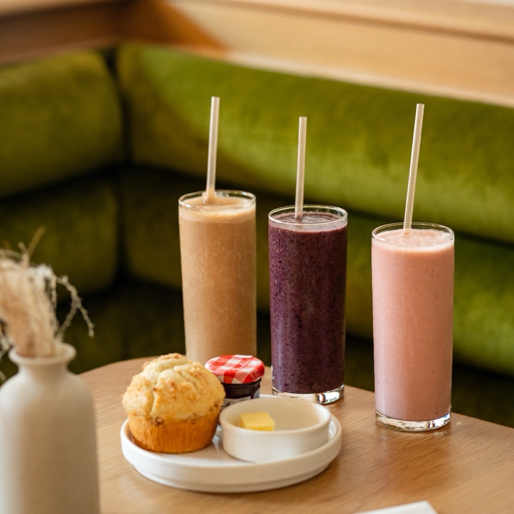 Strawberry, blueberry, and PB&J smoothies with a fresh scone at Café Maud