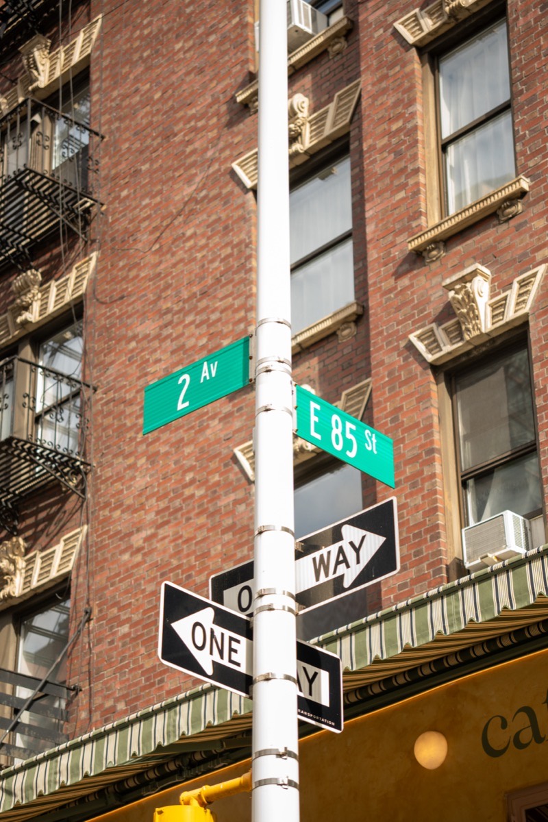 Street signs for 2nd Ave and E 85th St outside Café Maud Upper East Side